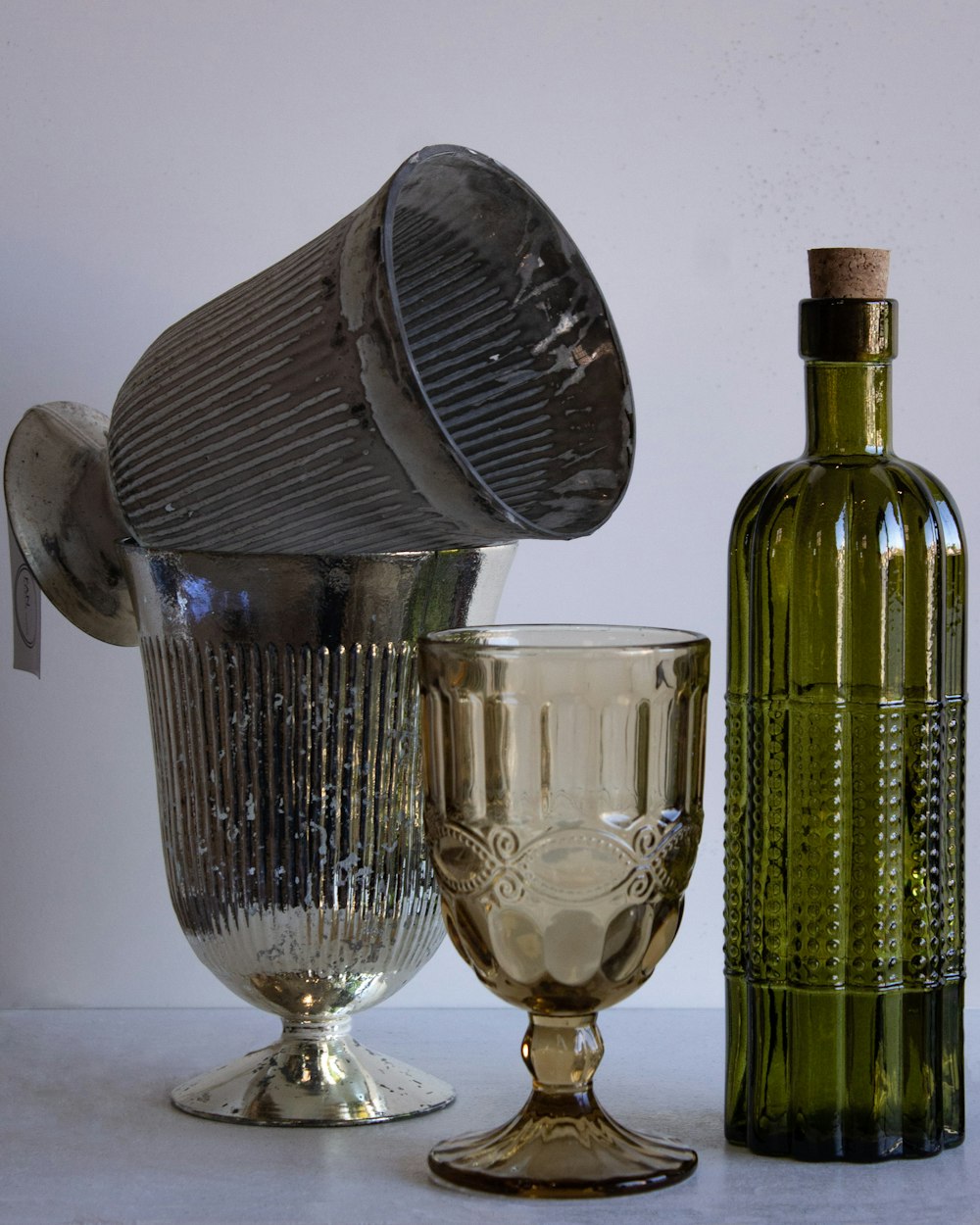 a wine glass and a wine bottle on a table