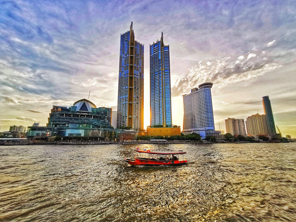 a couple of boats floating on top of a river