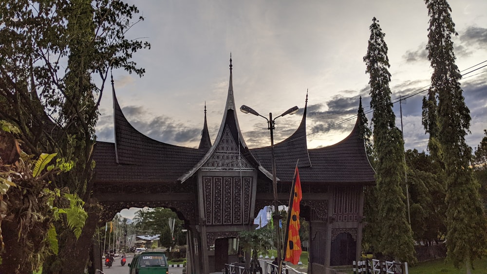 a wooden structure with a clock on the top of it