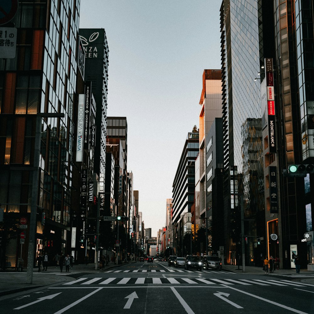 a city street filled with lots of tall buildings