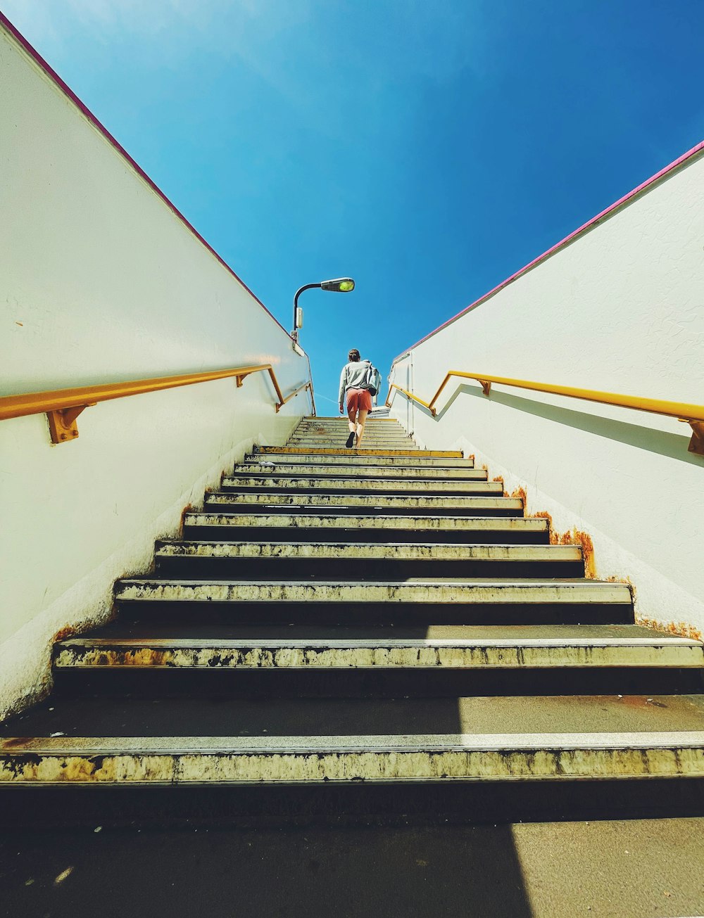 a man walking down a flight of stairs