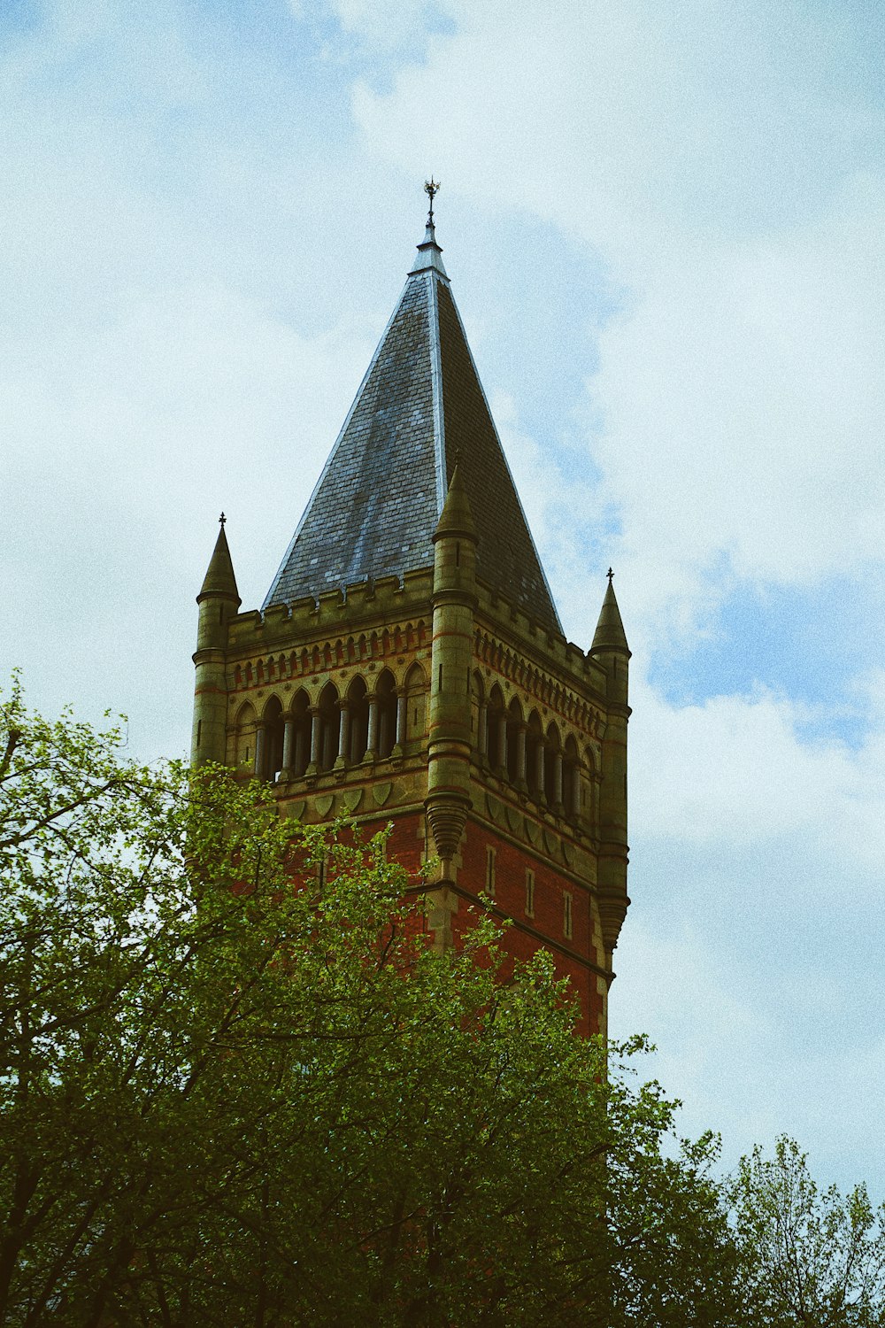 a tall tower with a clock on the top of it