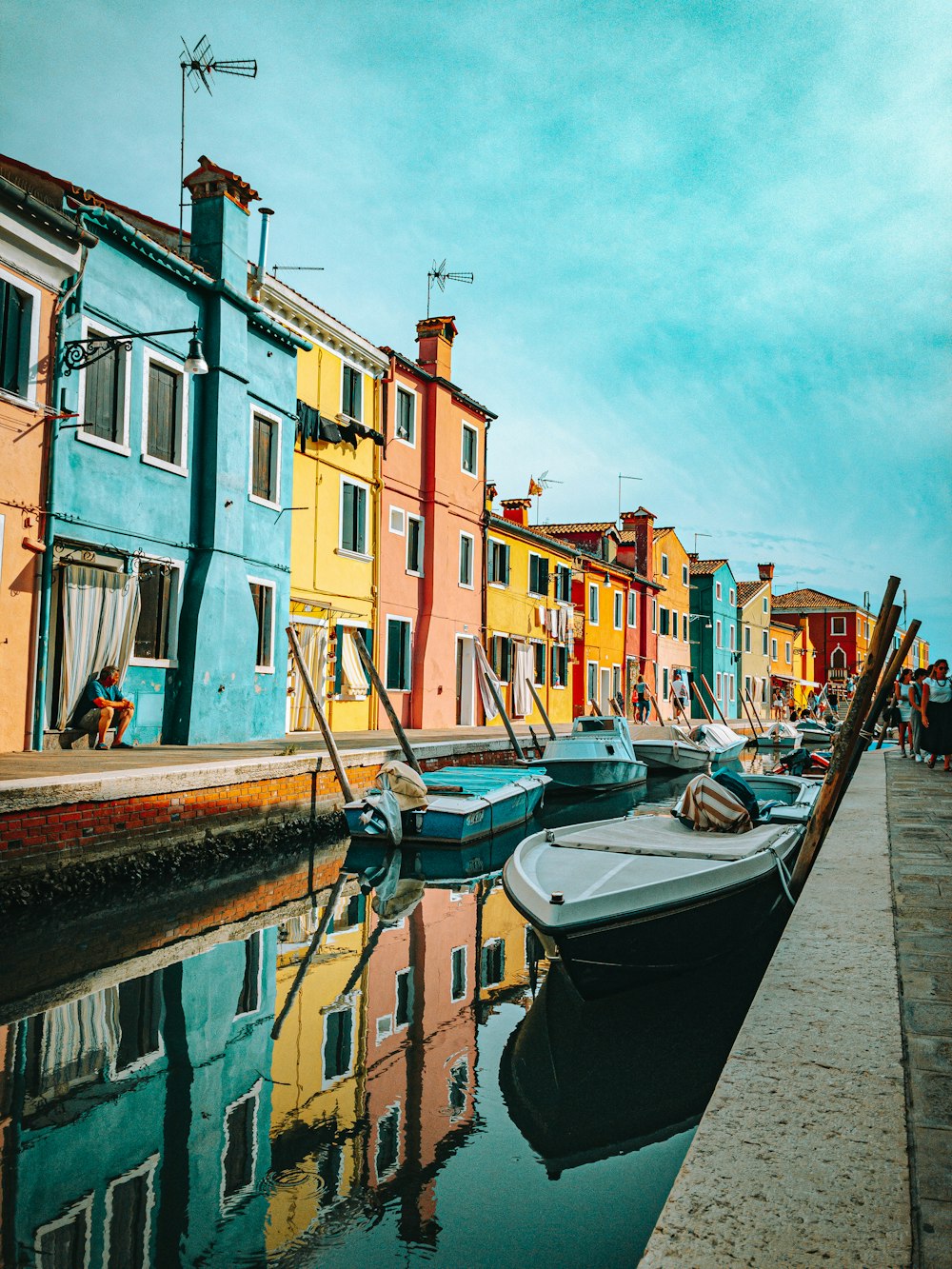 a row of houses next to a body of water