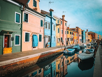 a row of houses next to a body of water
