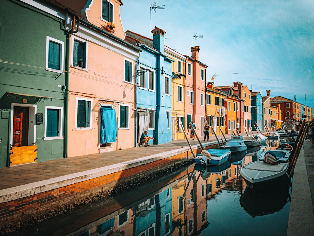 a row of houses next to a body of water