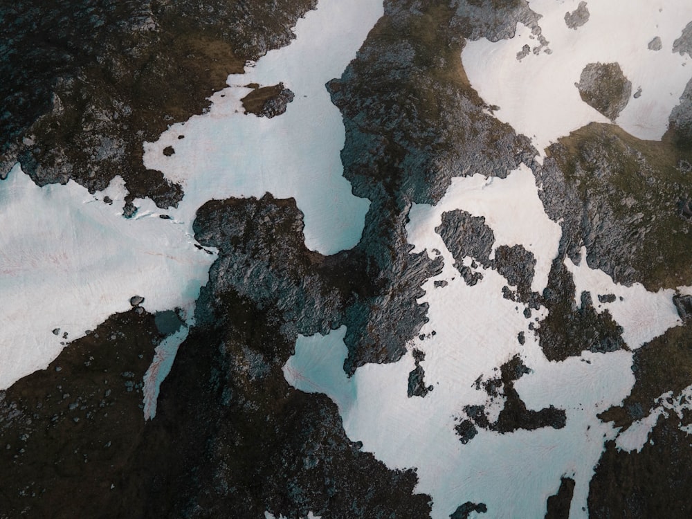 an aerial view of a snow covered mountain