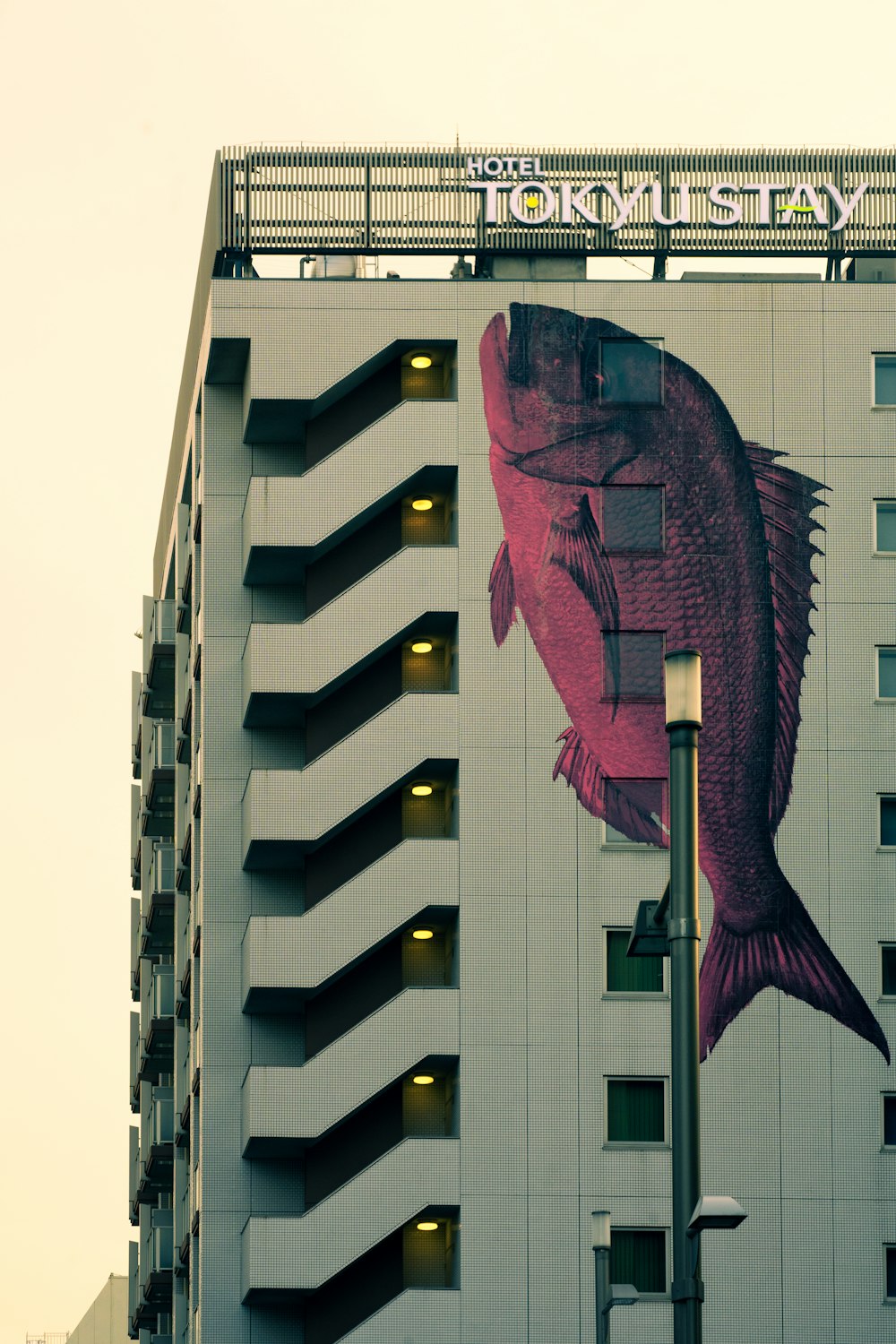 a large fish on the side of a building