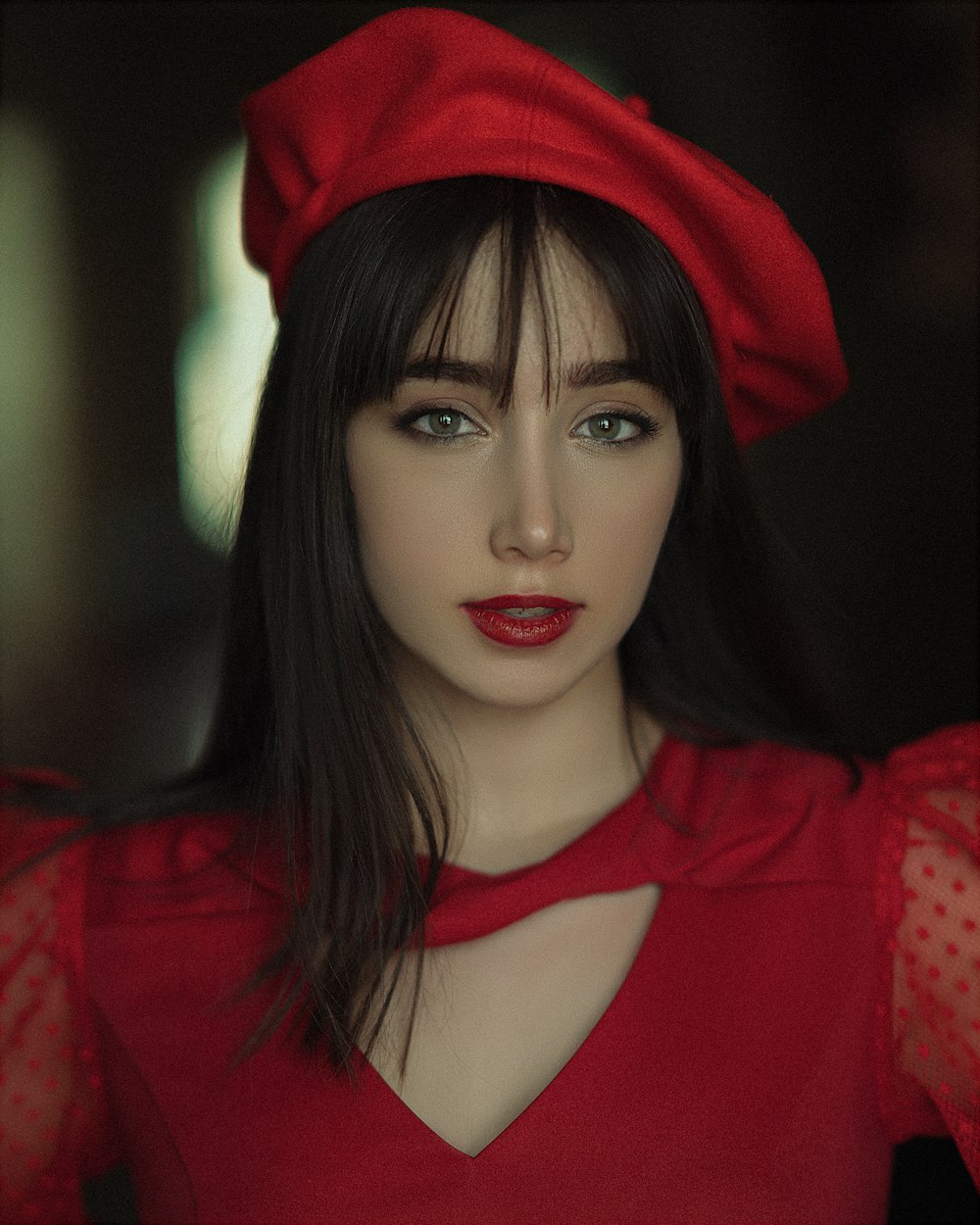 a close up of a person wearing a red hat