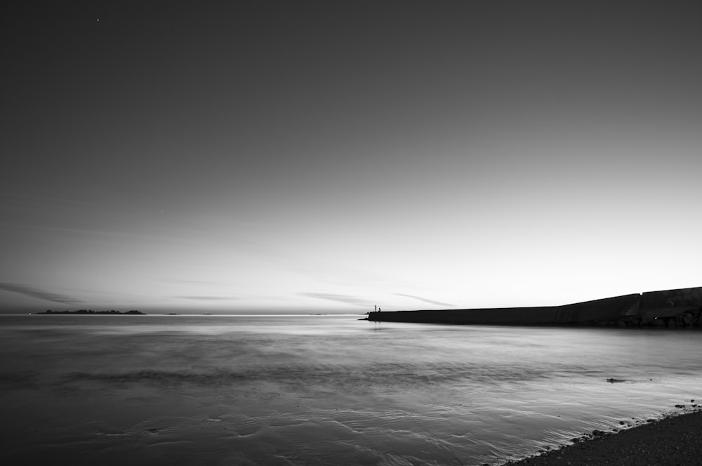 a black and white photo of a body of water