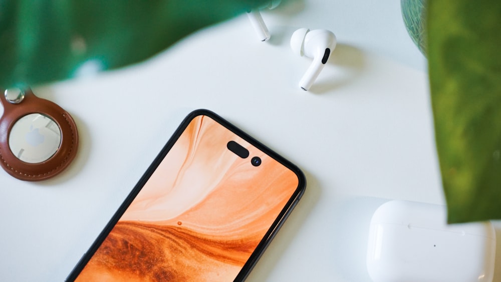 a cell phone sitting on top of a white table