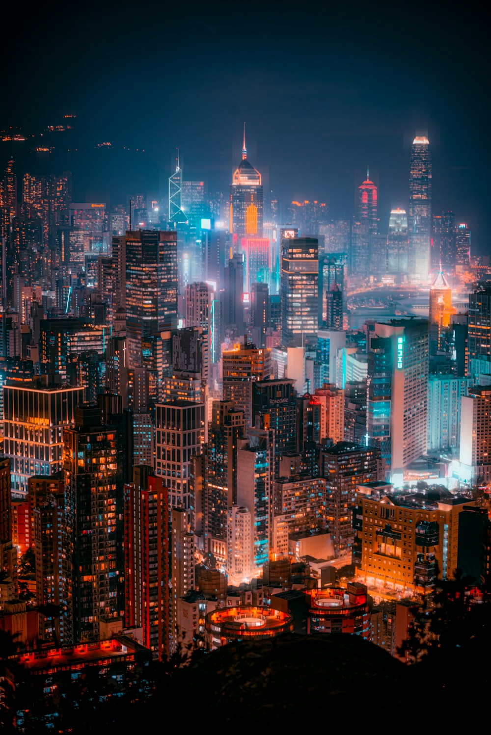 a city at night with a lot of tall buildings