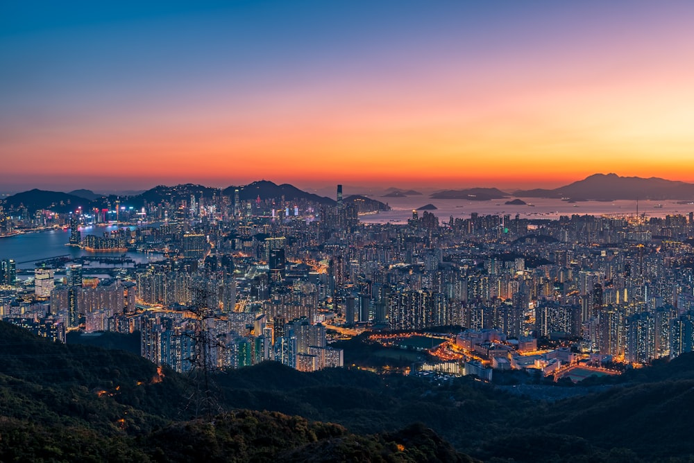 a view of a city at night from a hill