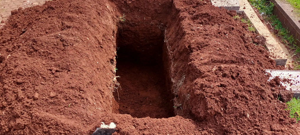 Before and after shots of a freshly leveled backyard showing clean, precise excavation work.