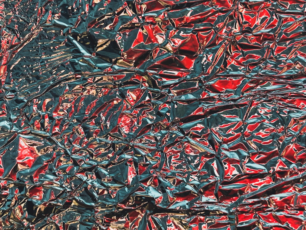 an abstract painting of red and green shapes
