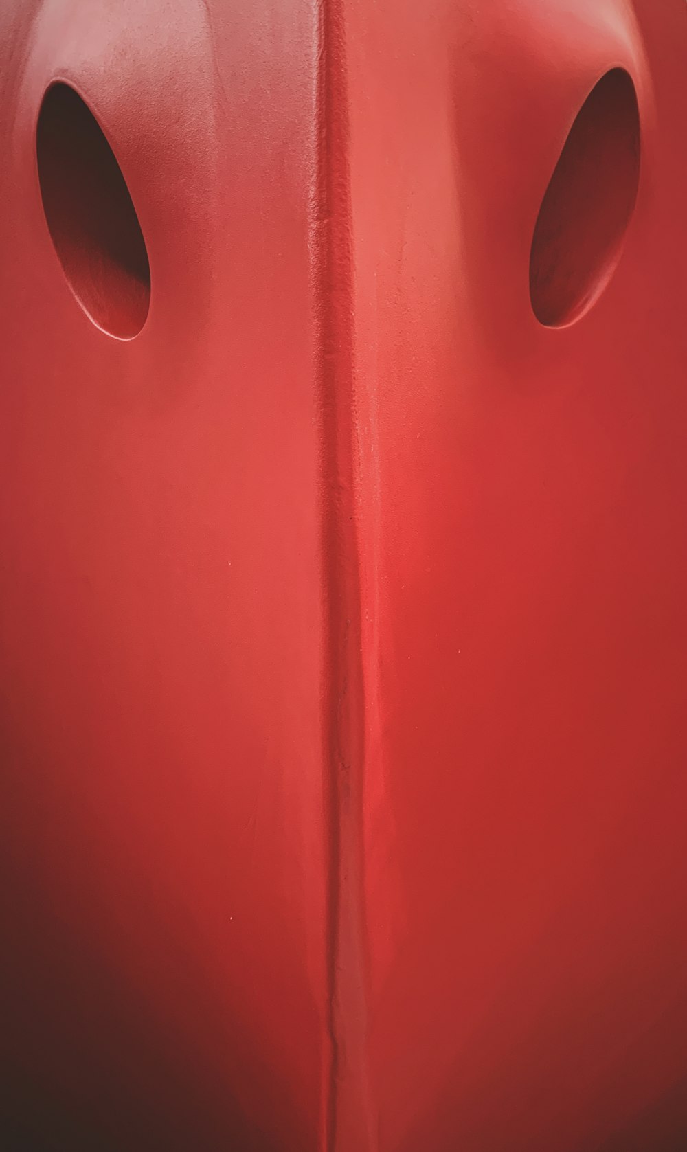 a close up of the side of a red boat