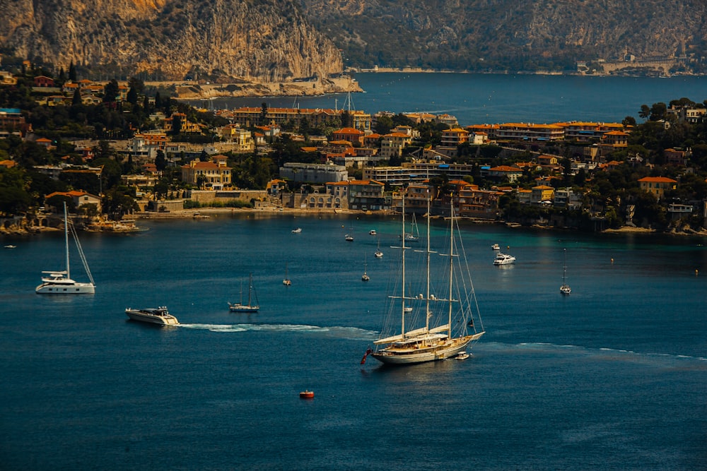 a group of boats floating on top of a body of water