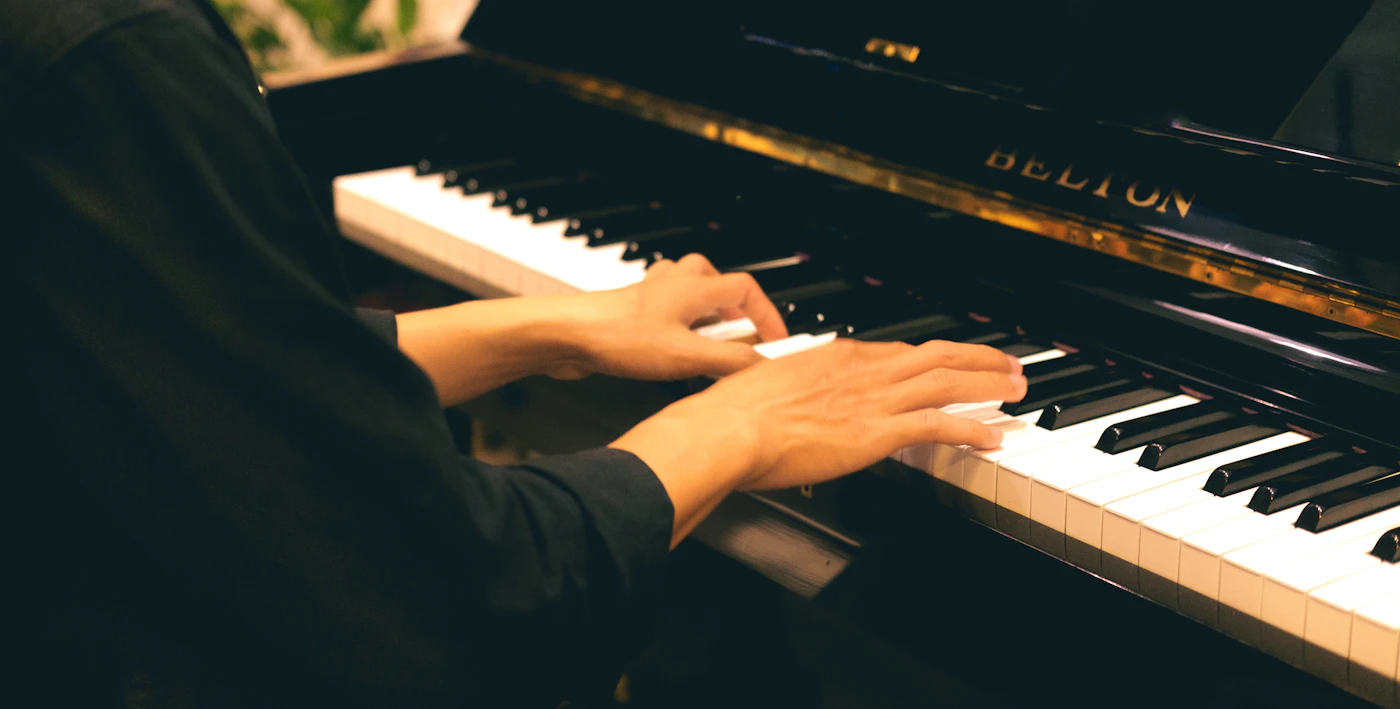 A pianist creating music at the keyboard