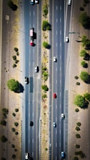 an aerial view of a highway with cars driving on it