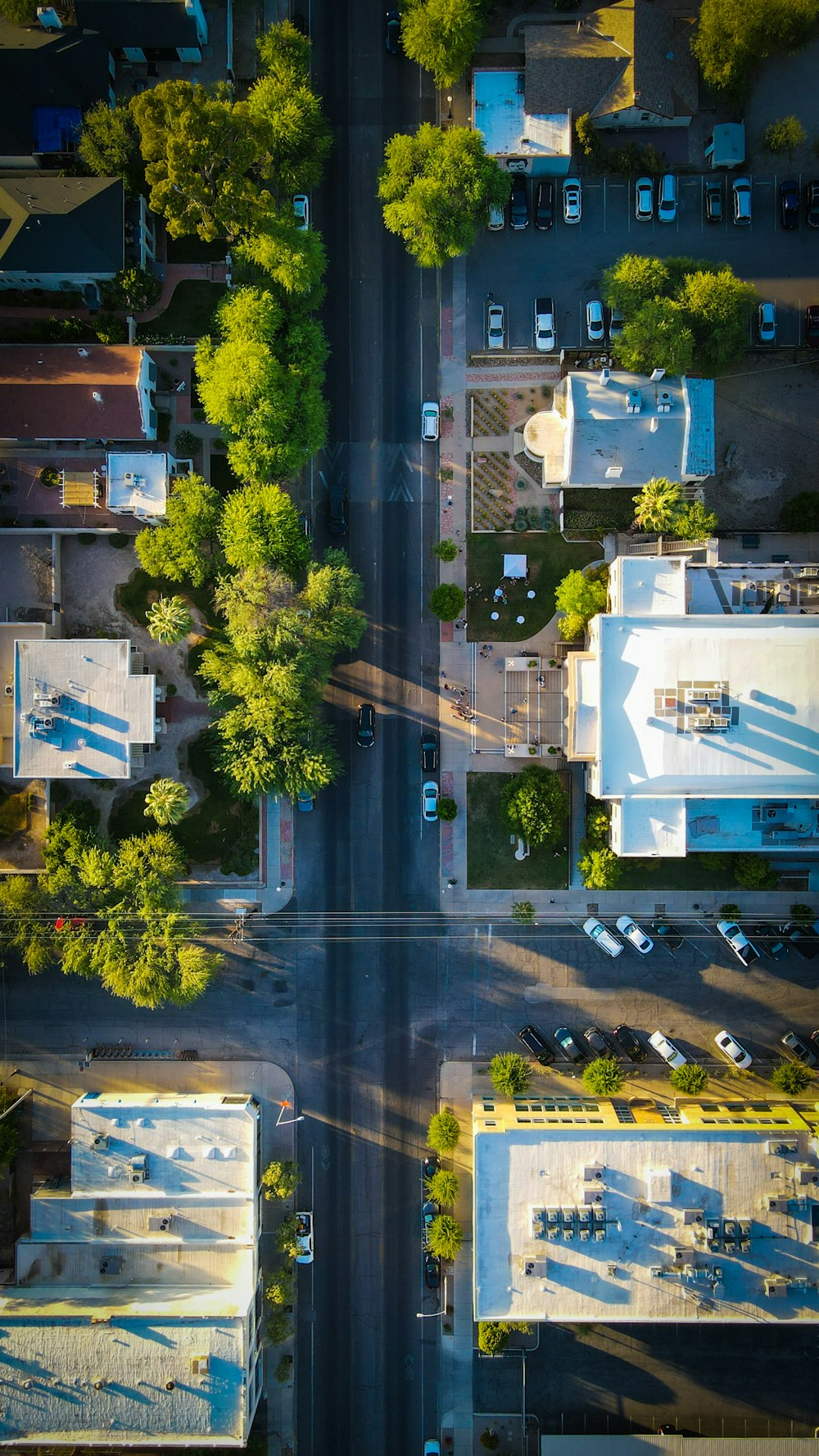 an aerial view of a street and a parking lot