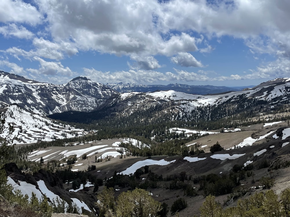 a view of a mountain range covered in snow