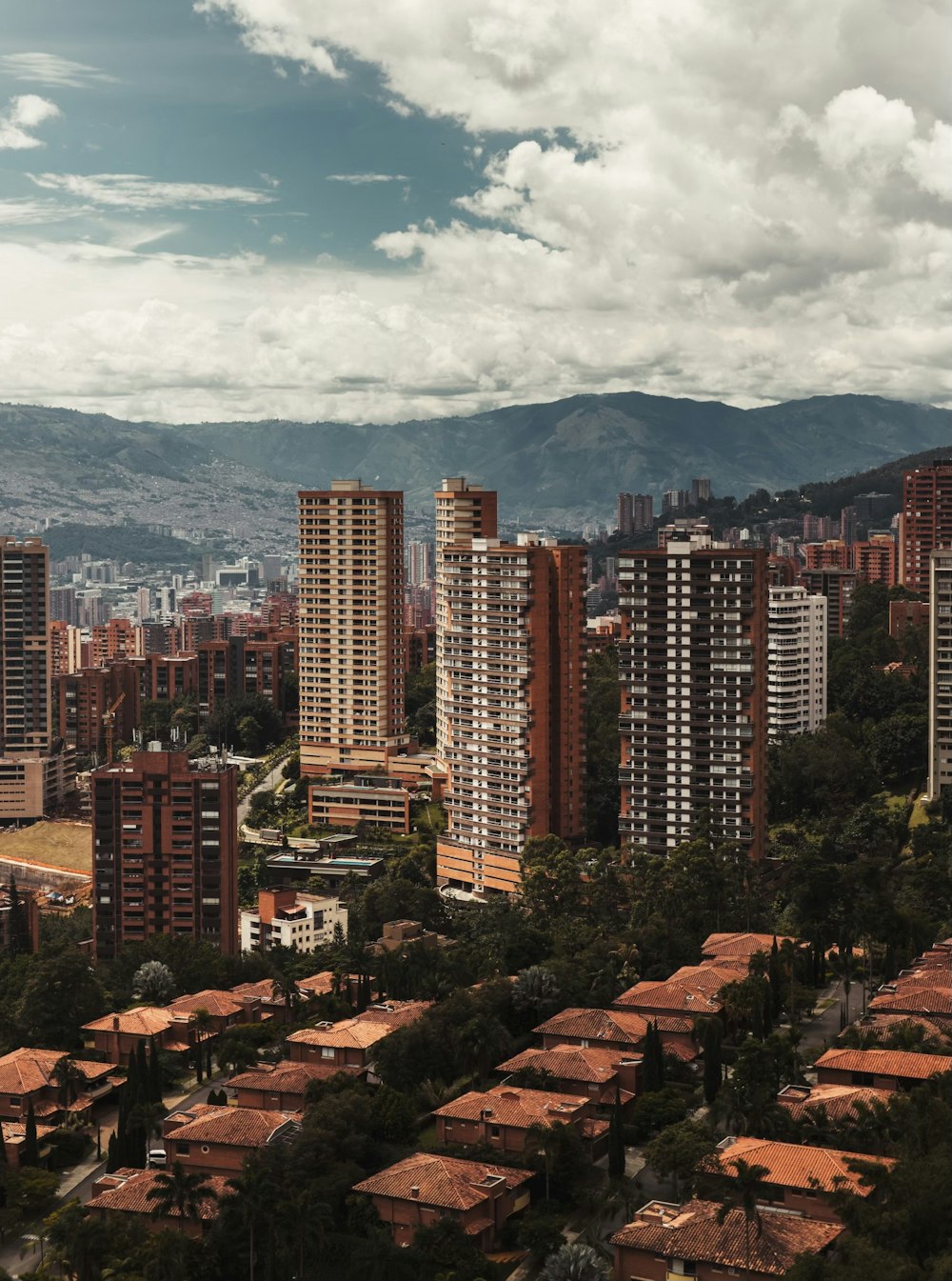 a view of a city with mountains in the background