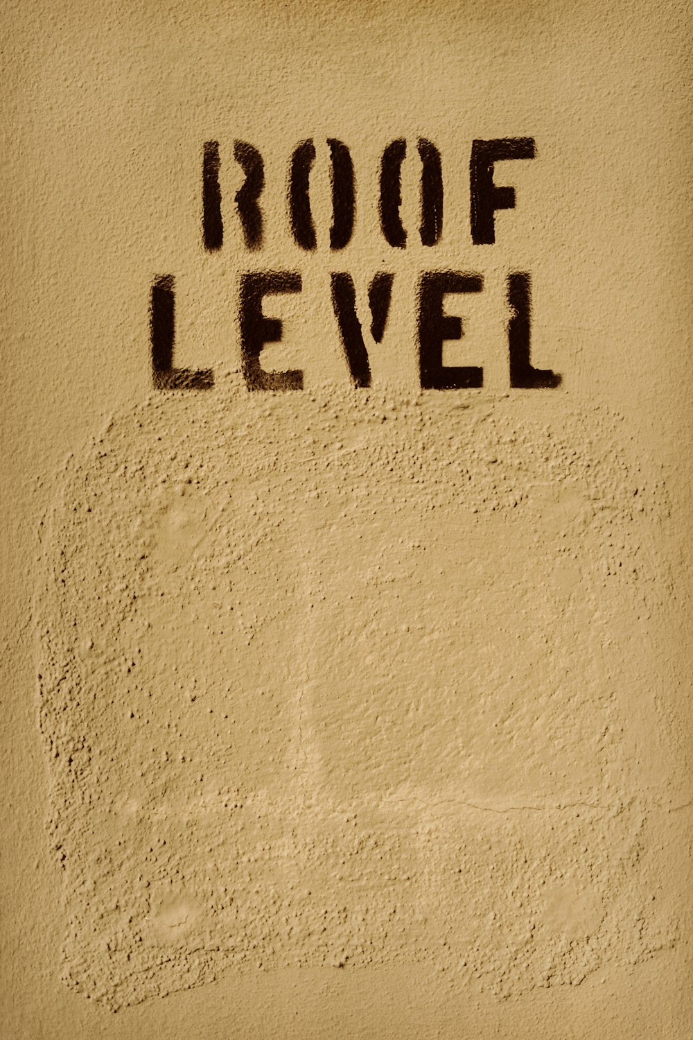 the word roof level written on a wall