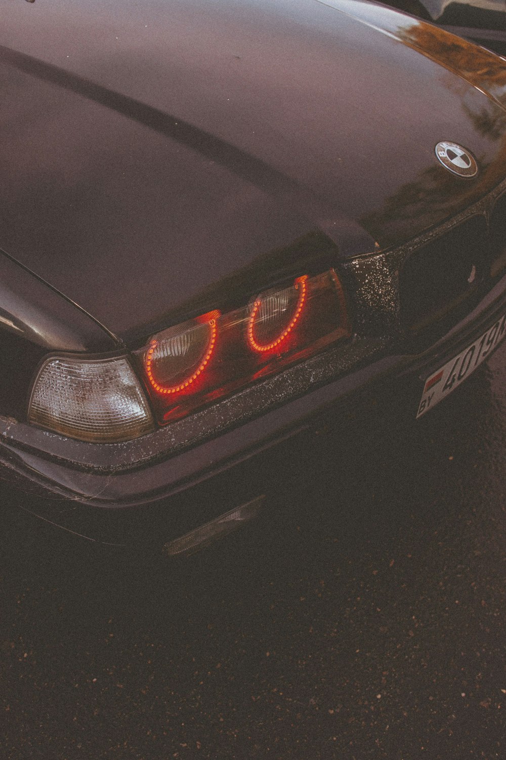 a close up of a car with its lights on