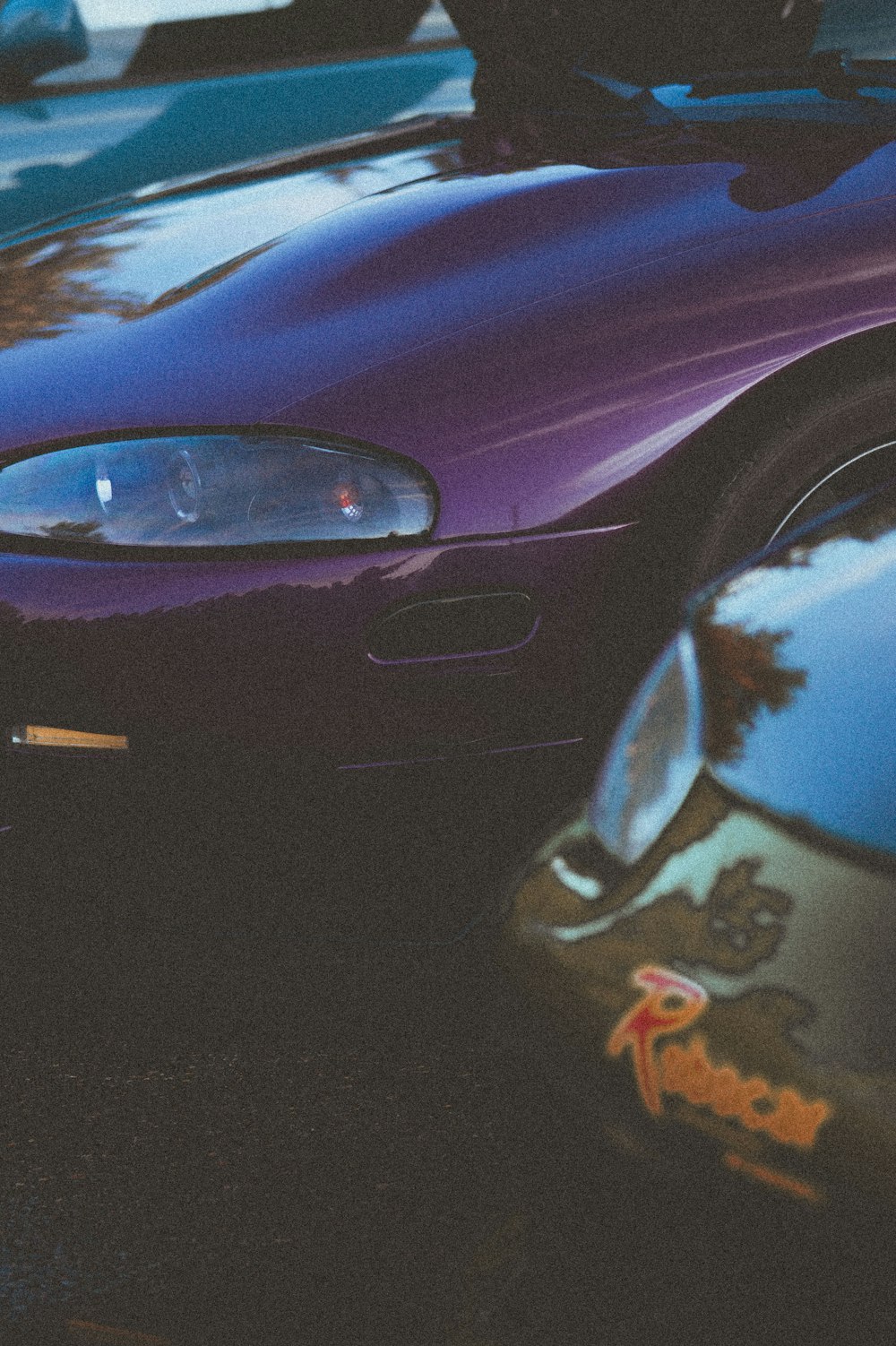 a close up of a purple sports car