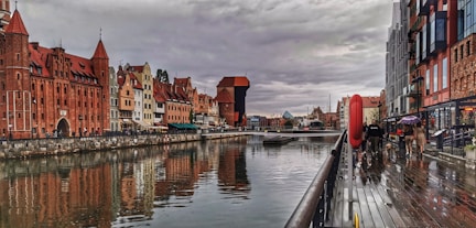 a river running through a city next to tall buildings