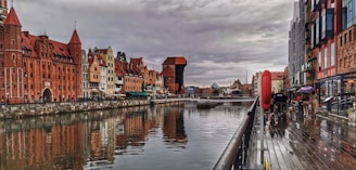 a river running through a city next to tall buildings