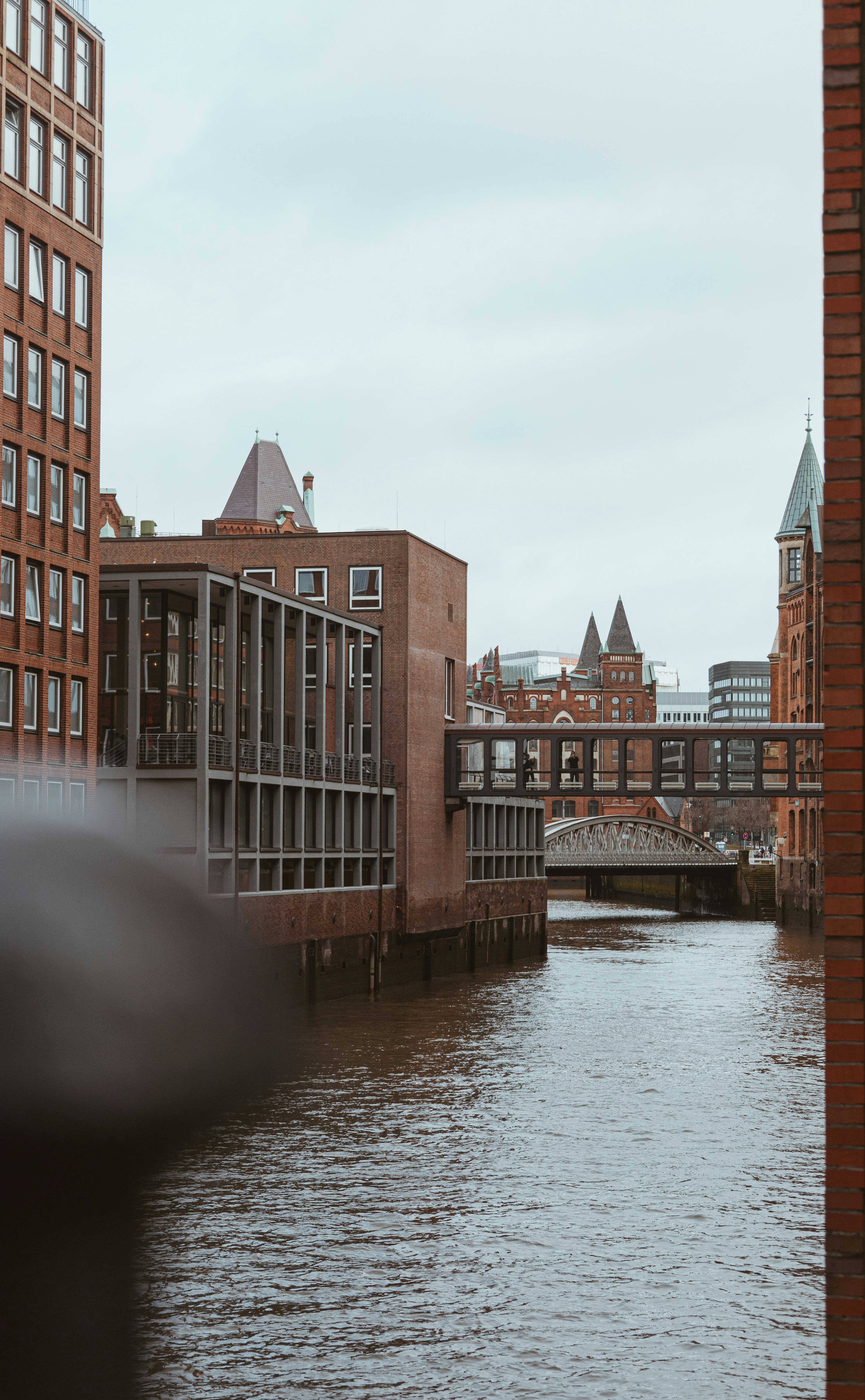 a body of water with buildings in the background