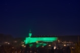 Evening view of the institute building illuminated against the Tartu skyline.