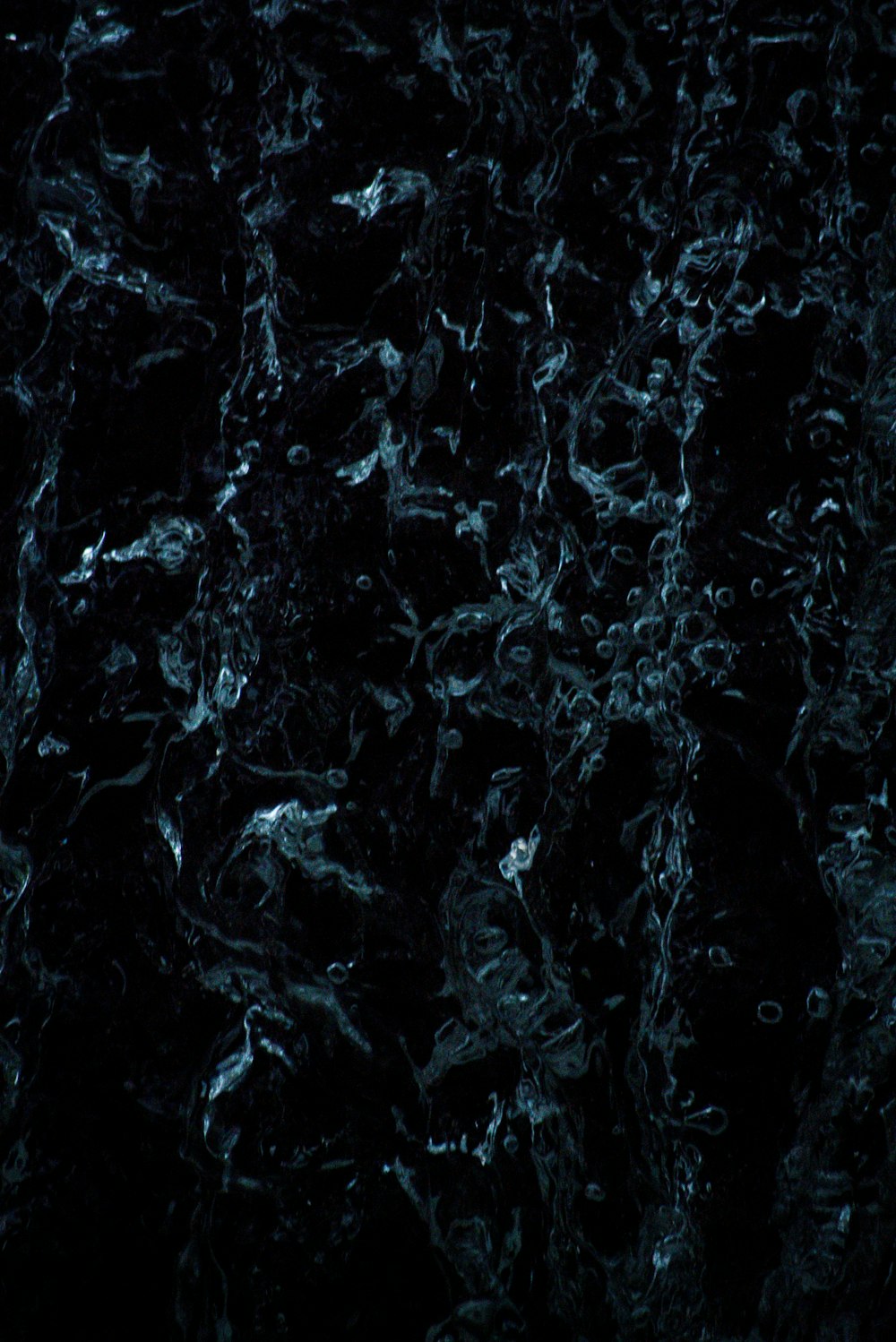 a close up of a black marble surface