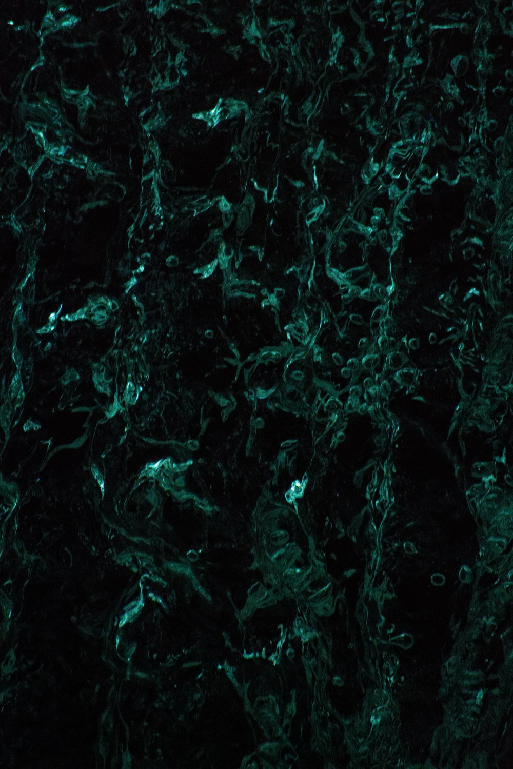 a black and green marble textured background