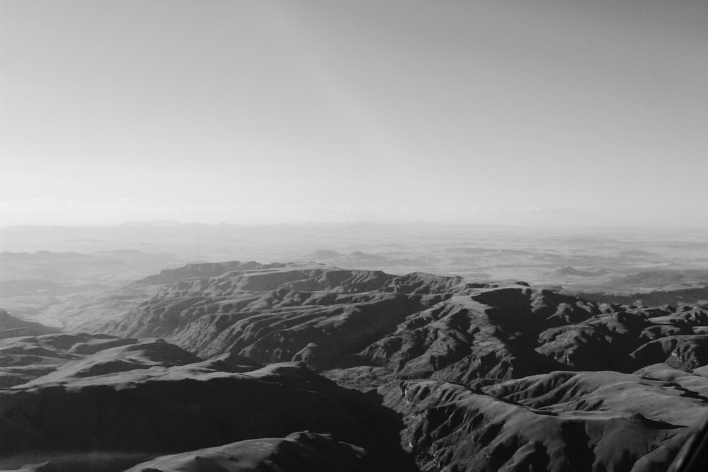 a black and white photo of a mountain range