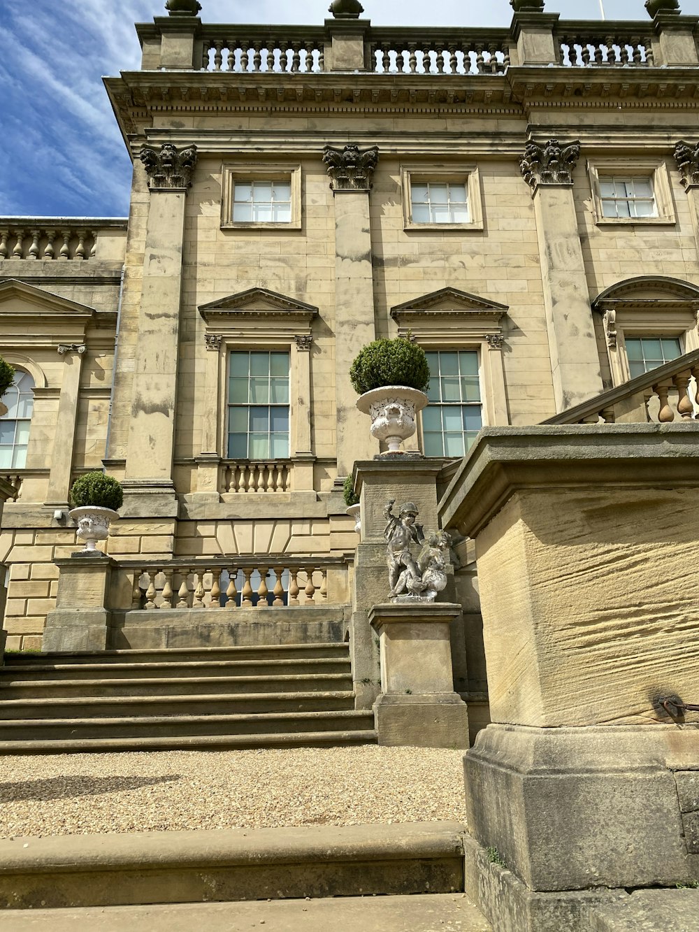 a large stone building with a staircase leading up to it