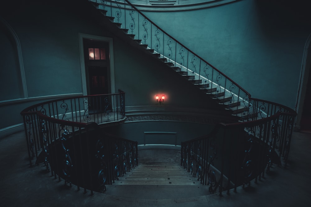 a staircase with a red light in the middle of it