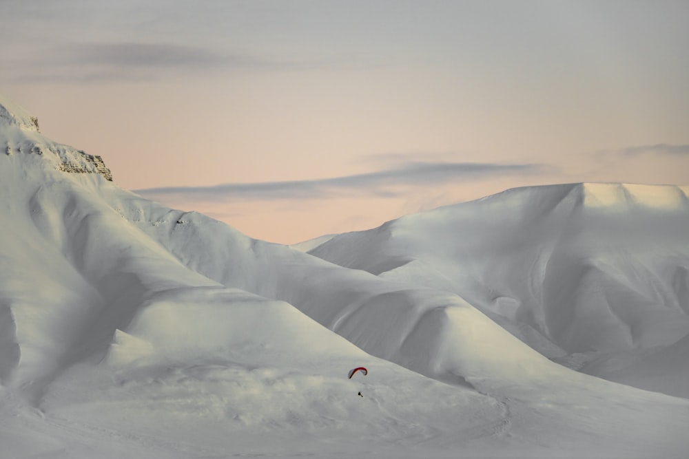 a person skiing down a snow covered mountain