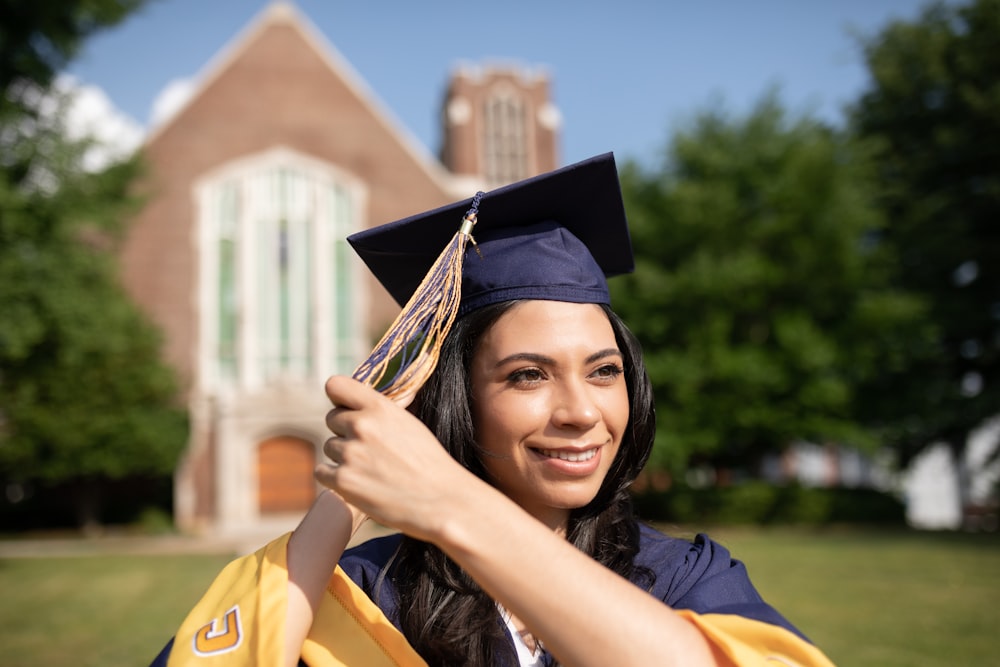 a woman in a graduation cap and gown