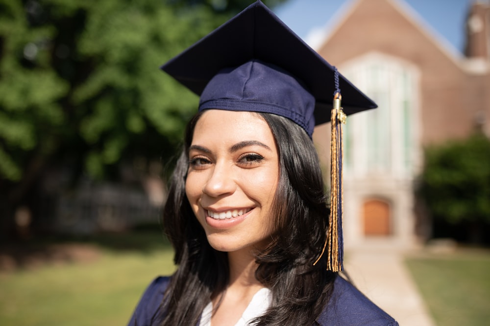 a woman wearing a graduation cap and gown