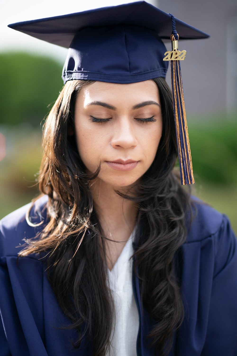 a woman wearing a graduation cap and gown