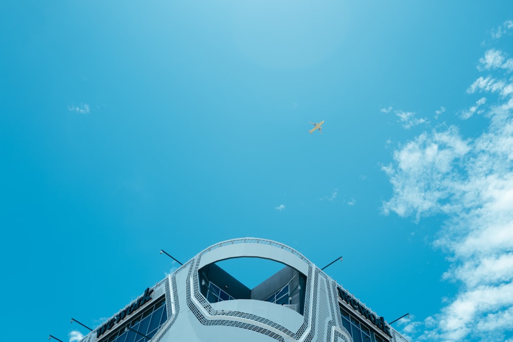 a large jetliner flying through a blue sky