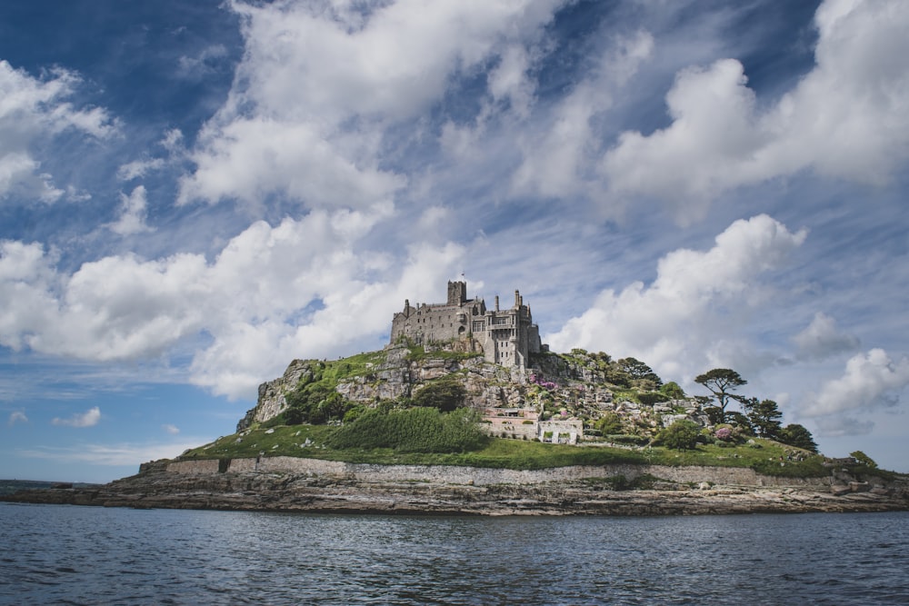 a castle sitting on top of a small island