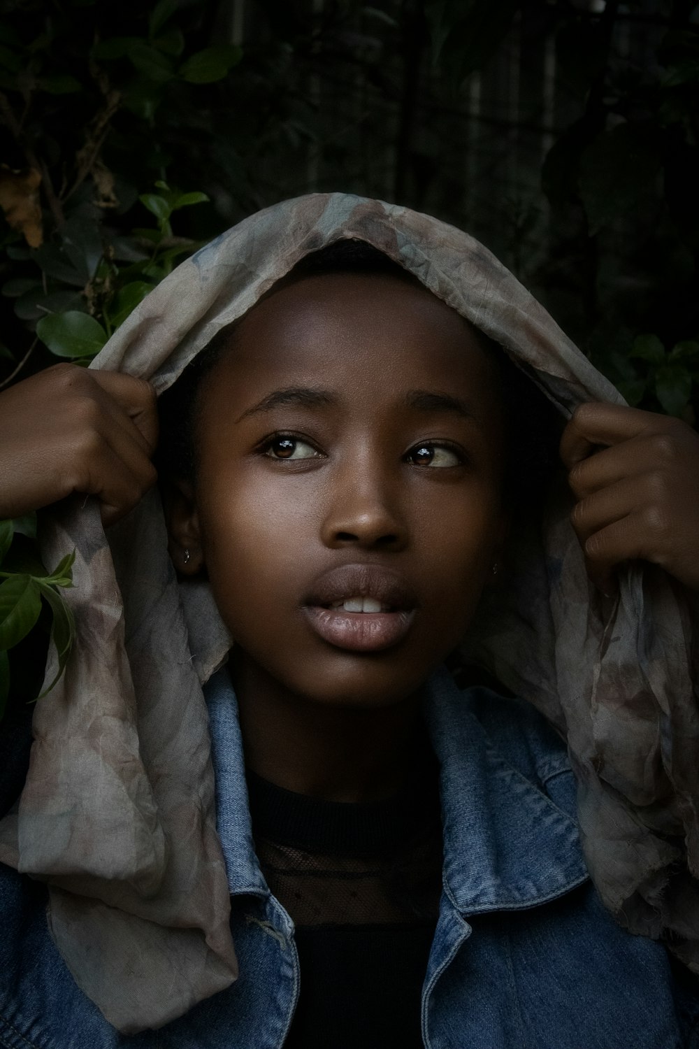 a woman with a hood on her head