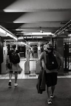 a couple of people that are walking down a sidewalk