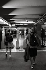 a couple of people that are walking down a sidewalk
