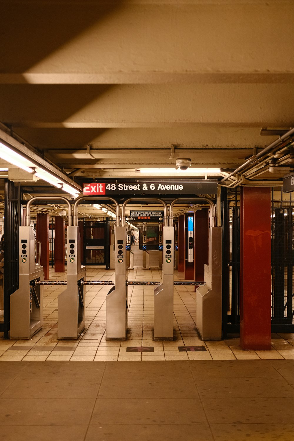 a subway station with red and white doors