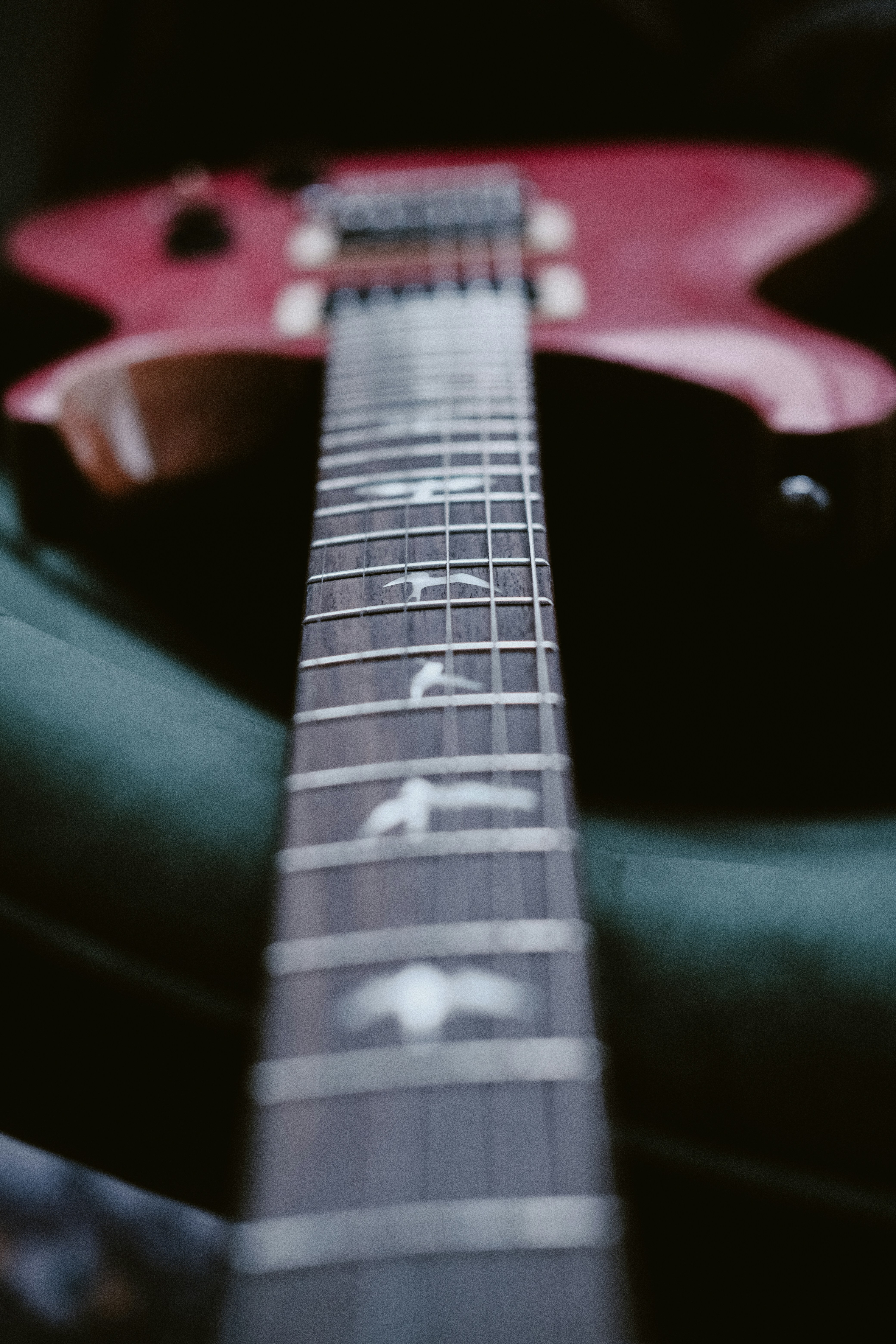 a close up of a red electric guitar