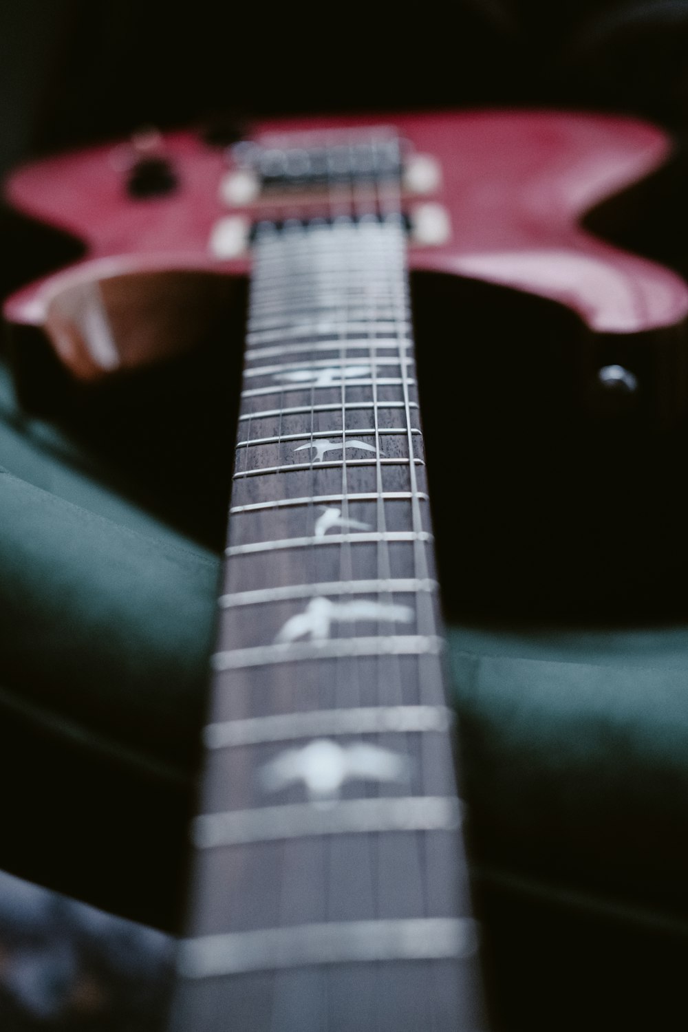 a close up of a red electric guitar