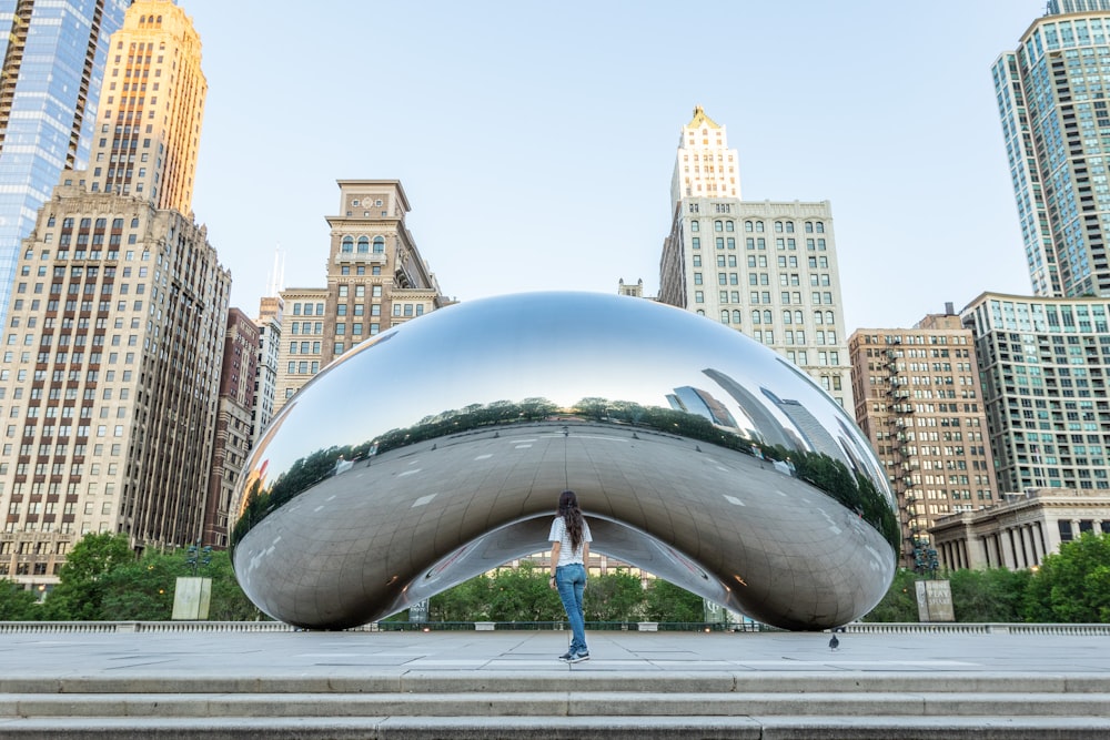 a person standing in front of a large metal object